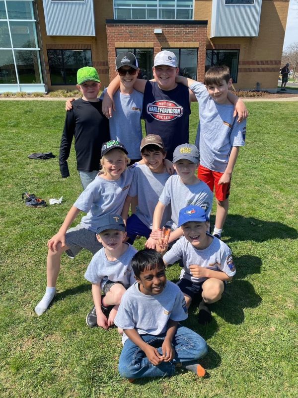 Group of Cadet boys posed in team photo on the lawn
