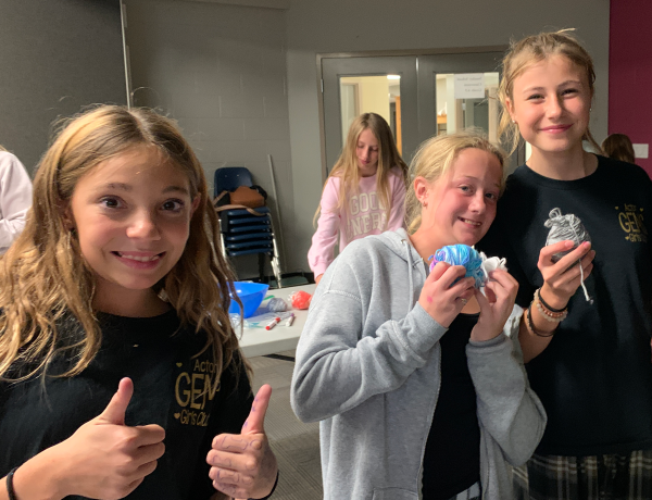 3 GEMs girls showing off their crafts